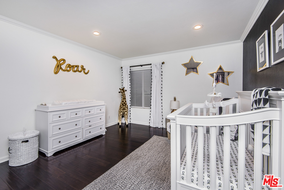 4200 Vía Dolce, Unit 129 Marina del Rey, CA 90292 - Photo 16 of 30 a view of a bedroom with baby crib