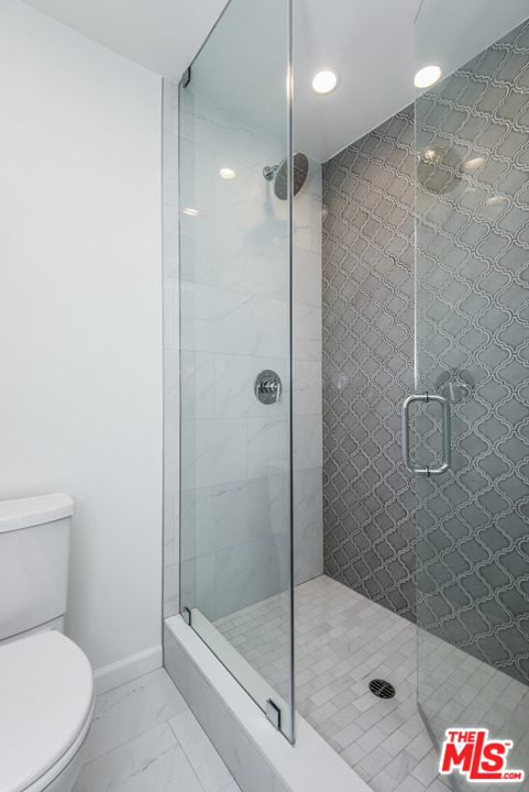 4200 Vía Dolce, Unit 129 Marina del Rey, CA 90292 - Photo 17 of 30 a bathroom with a shower a toilet and a shower