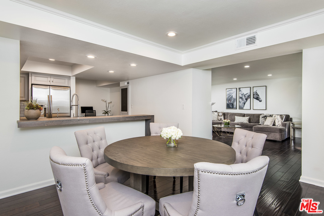 4200 Vía Dolce, Unit 129 Marina del Rey, CA 90292 - Photo 4 of 30 a view of a dining room with furniture and wooden floor