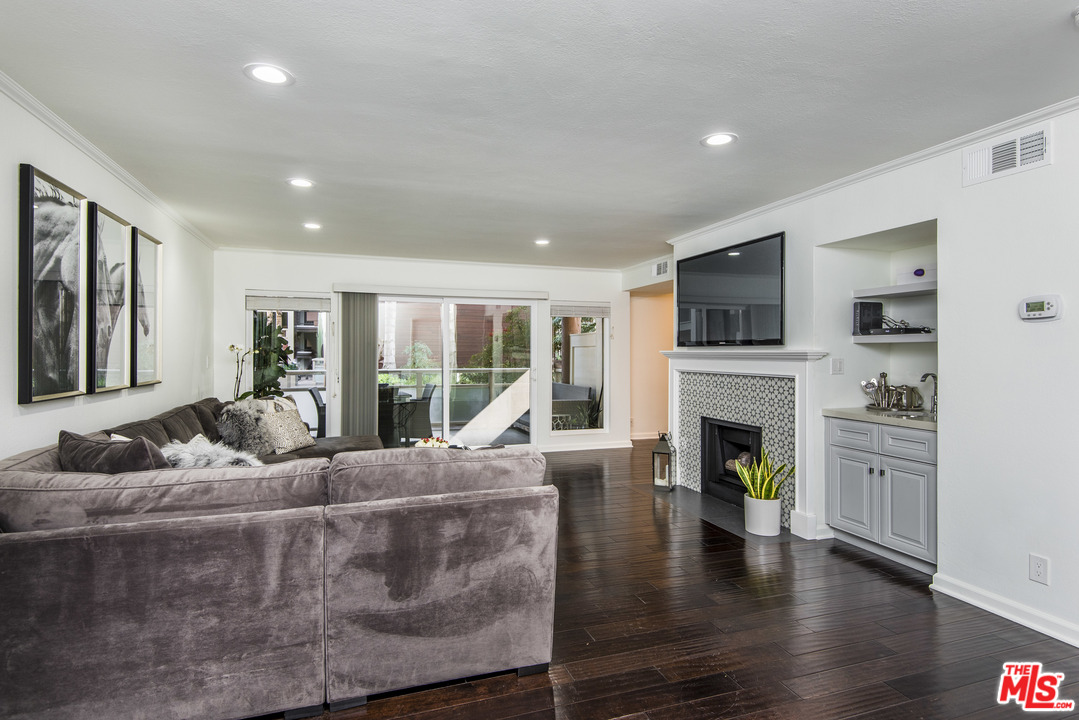 4200 Vía Dolce, Unit 129 Marina del Rey, CA 90292 - Photo 5 of 30 a living room with fireplace furniture and a fireplace