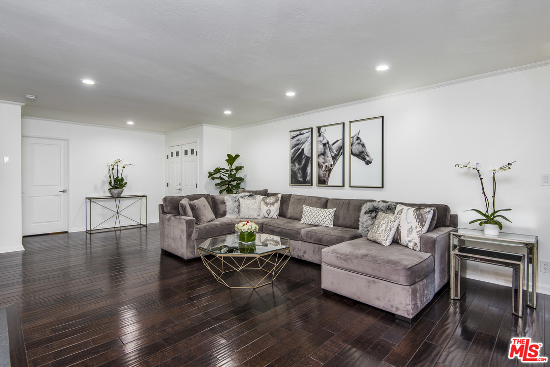 4200 Vía Dolce, Unit 129 Marina del Rey, CA 90292 - Photo 7 of 30 a living room with furniture and wooden floor
