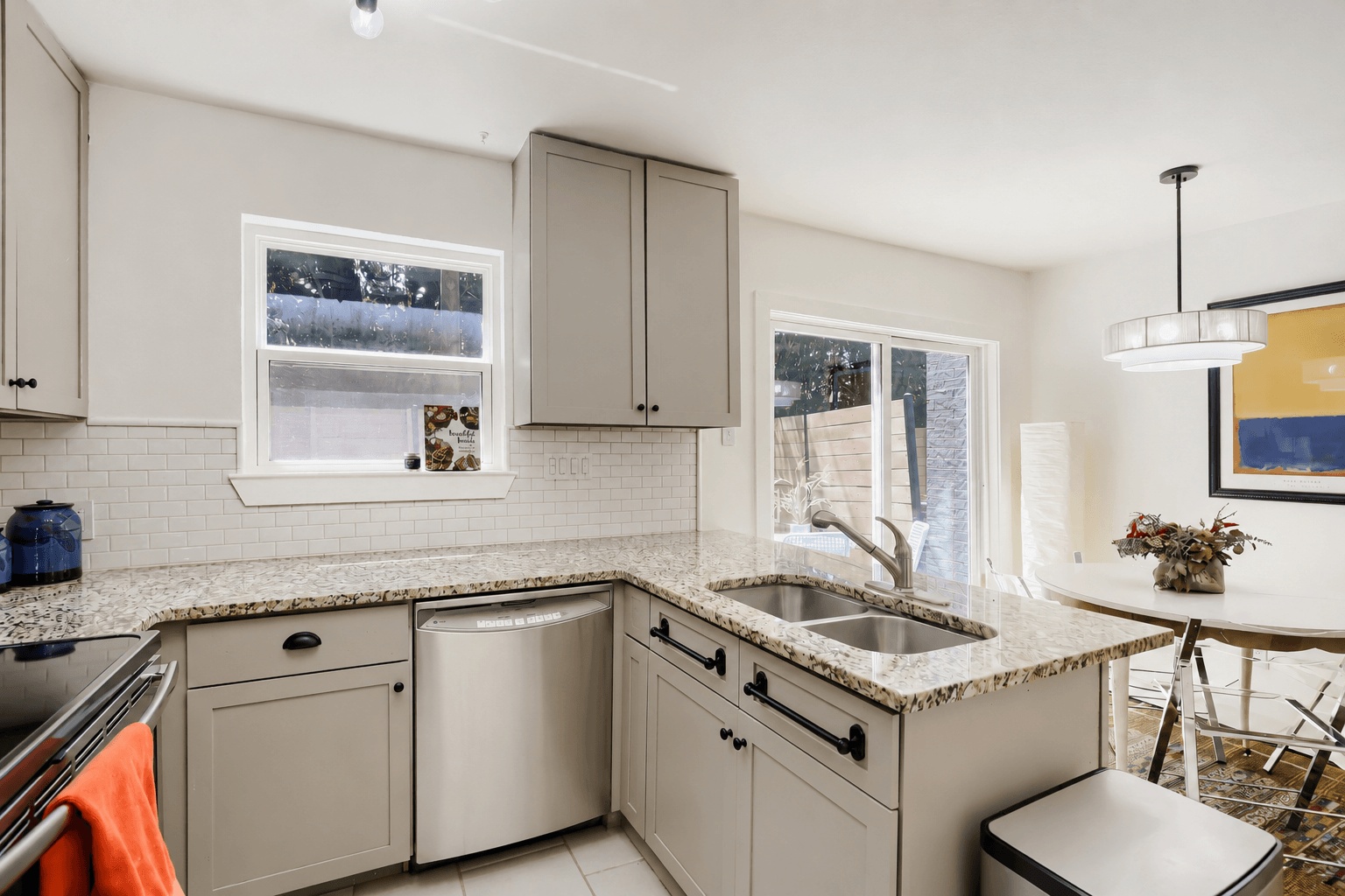 6211 Manor Road, Unit 105 Austin, TX 78723 - Photo 8 of 18 This bright kitchen with slider window over the sink features recent appliances and opens to dining area and private backyard.