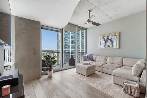 a view of walk in closet with clothes