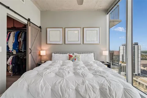 a view of a bedroom with washer and dryer