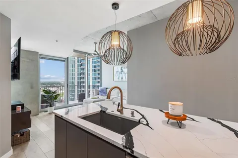 a bedroom with a large bed and a balcony view