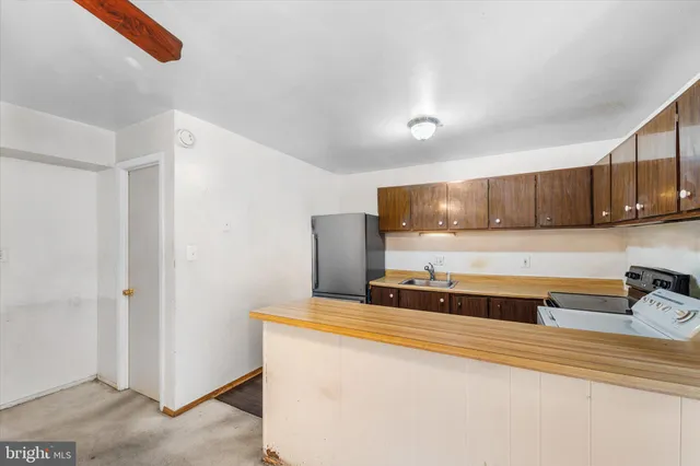 a view of a kitchen with a sink cabinets and a window