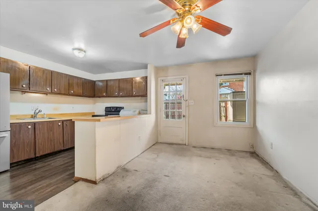 a white toilet sitting next to a white sink