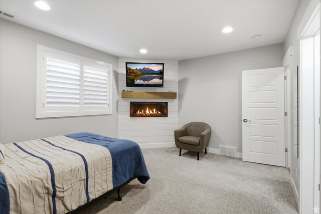 21 Pier Place Tooele, UT 84074 - Photo 76 of 112 Corner fireplace with shiplap surround and wood-finish mantel