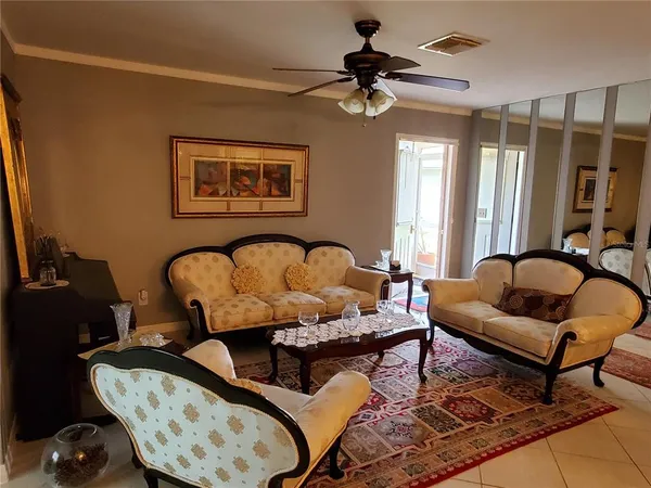 a living room with furniture and a window