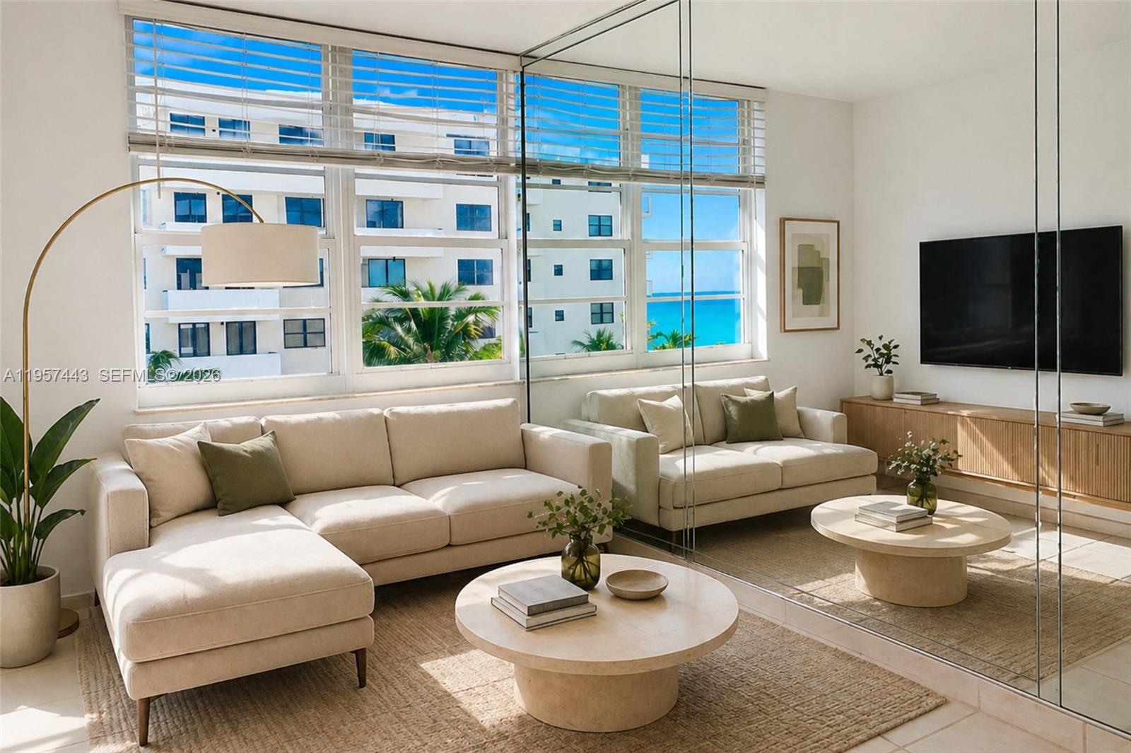 a living room with furniture a rug and a window
