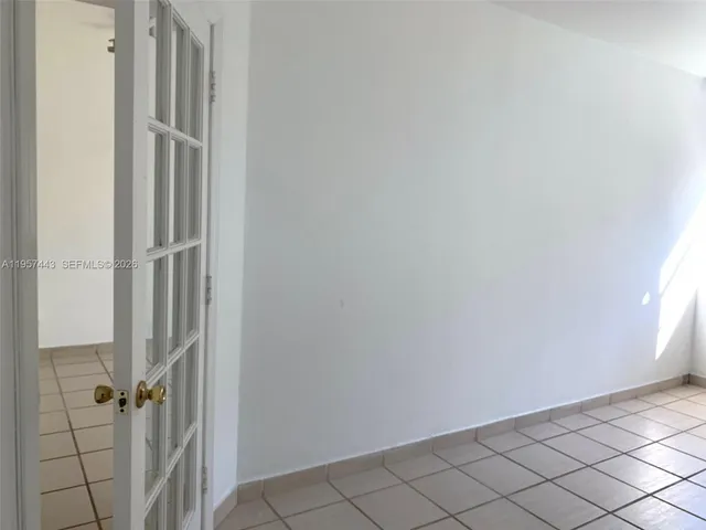 a view of an empty room and window