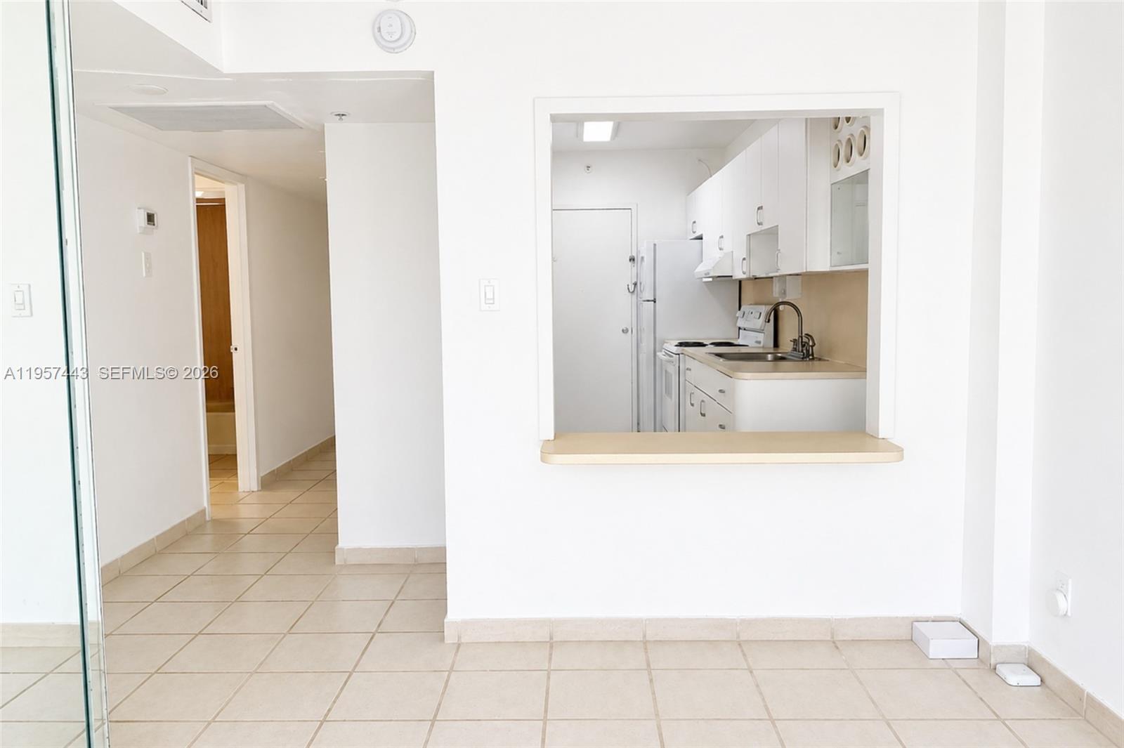 100 Lincoln Road, Unit 732 Miami Beach, FL 33139 - Photo 4 of 20 a view of a kitchen with wooden floor