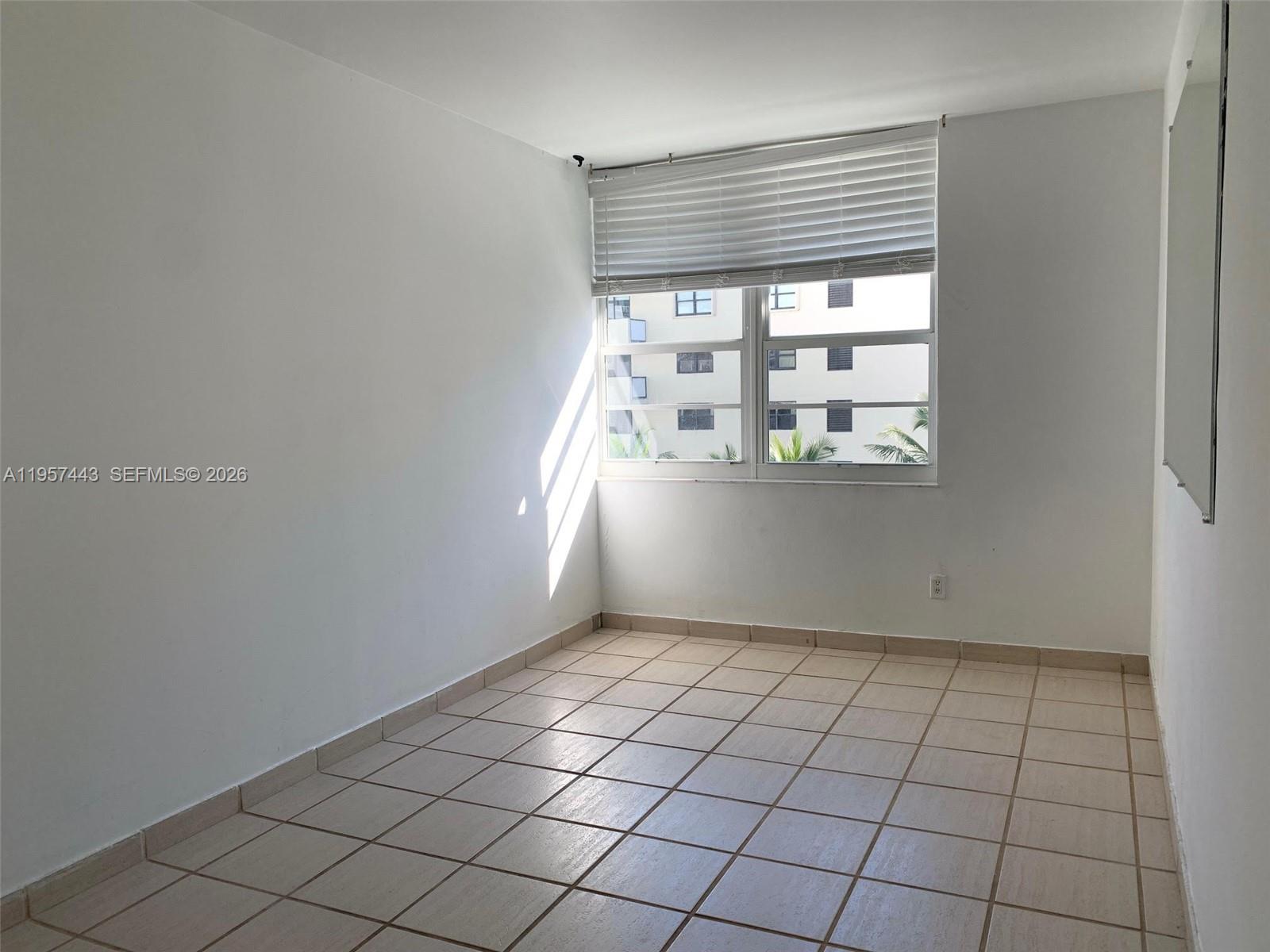 100 Lincoln Road, Unit 732 Miami Beach, FL 33139 - Photo 10 of 20 a view of an empty room and window