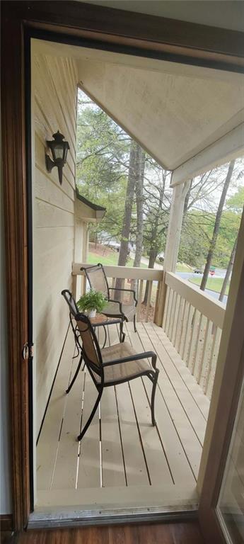 340 Farm Path Roswell, GA 30075 - Photo 14 of 21 a view of a balcony with chairs and wooden floor