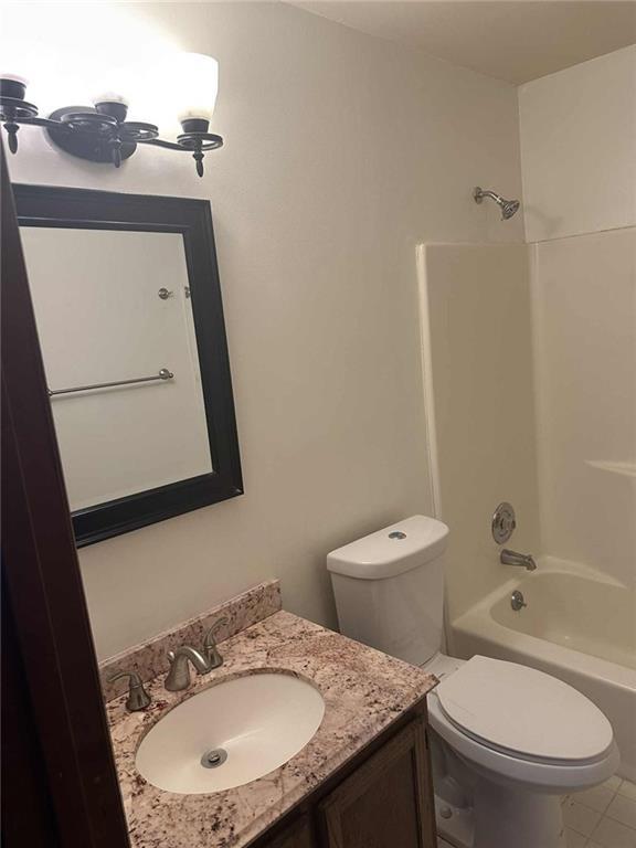 340 Farm Path Roswell, GA 30075 - Photo 17 of 21 a bathroom with a granite countertop toilet sink and mirror
