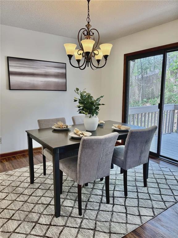 340 Farm Path Roswell, GA 30075 - Photo 6 of 21 a view of a dining room with furniture window and wooden floor