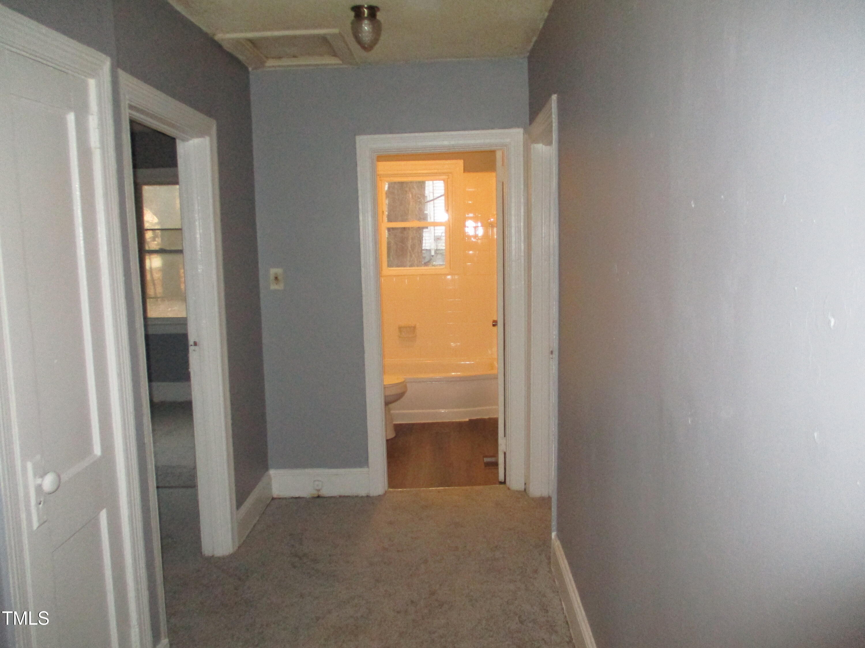 307 Angier Avenue Raleigh, NC 27610 - Photo 8 of 9 a view of an empty room and window