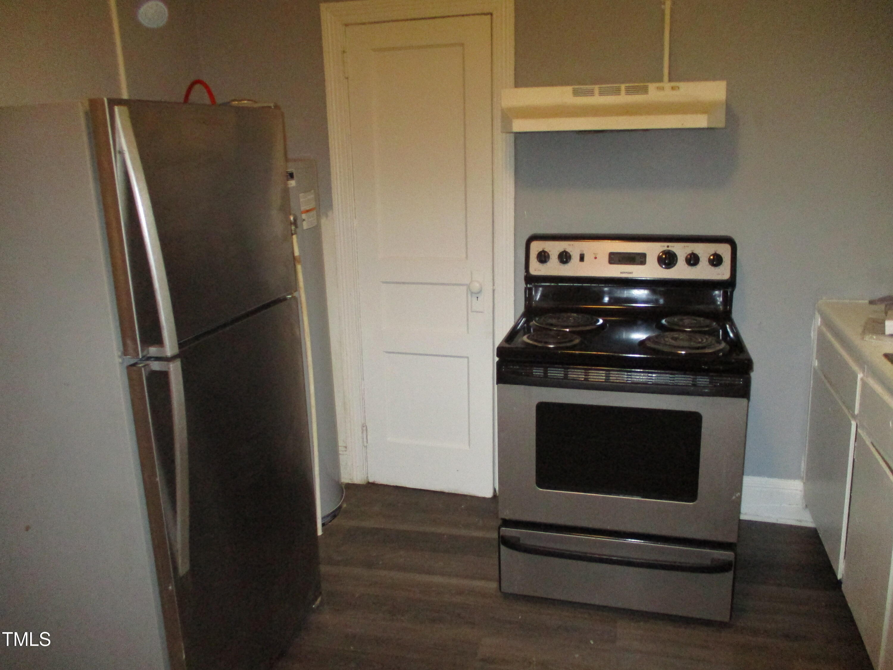 307 Angier Avenue Raleigh, NC 27610 - Photo 9 of 9 a kitchen with a refrigerator stove and cabinets