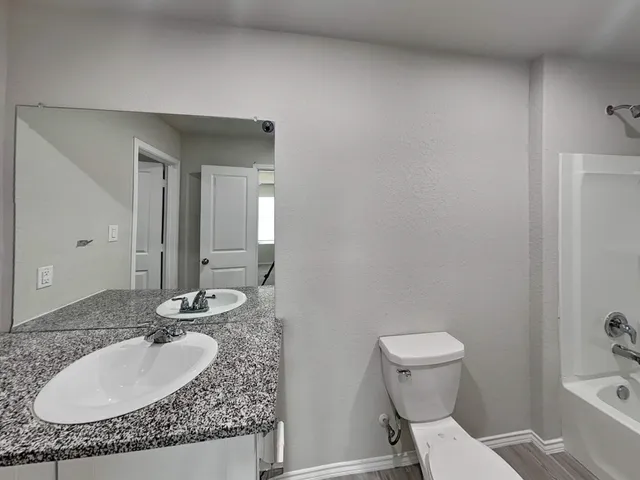 a big house with a big yard and large tree