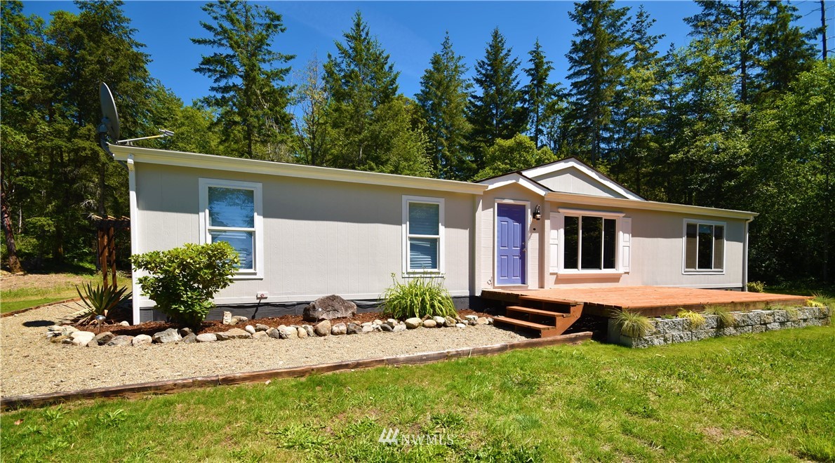 267 East Victor Road Belfair, WA 98528 - Photo 1 of 27 a front view of house with yard and green space