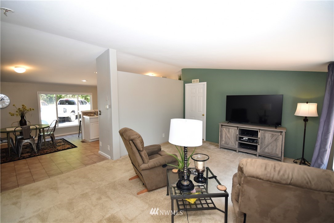 267 East Victor Road Belfair, WA 98528 - Photo 13 of 27 a living room with furniture and a flat screen tv