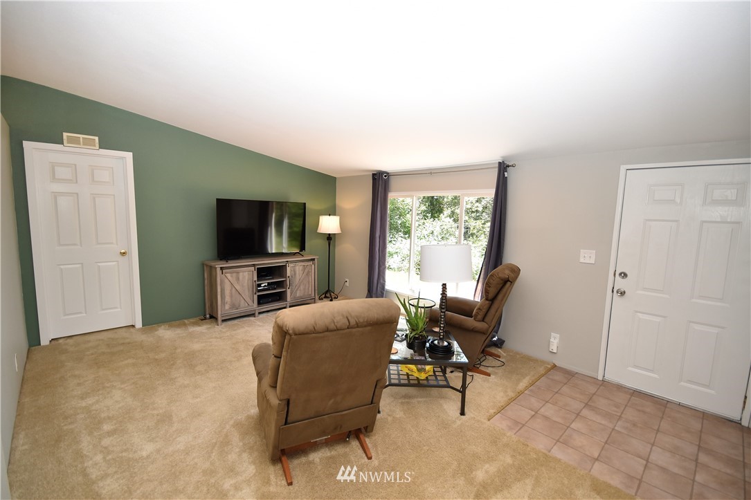 267 East Victor Road Belfair, WA 98528 - Photo 14 of 27 a living room with furniture and a flat screen tv