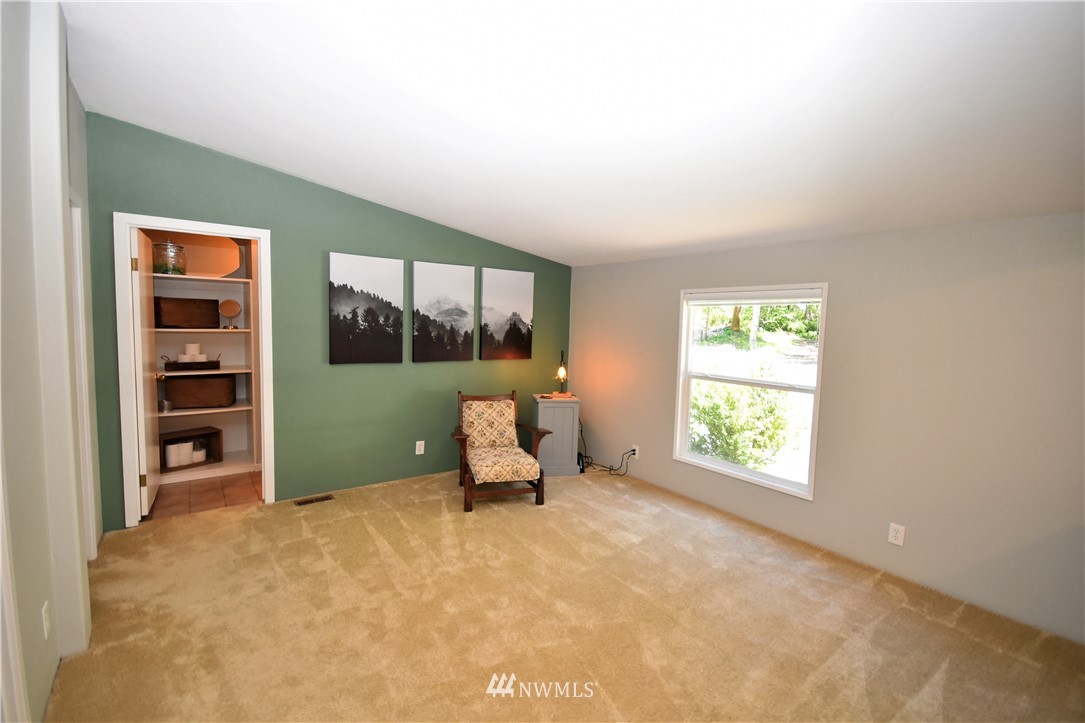 267 East Victor Road Belfair, WA 98528 - Photo 16 of 27 an empty room with windows and closet