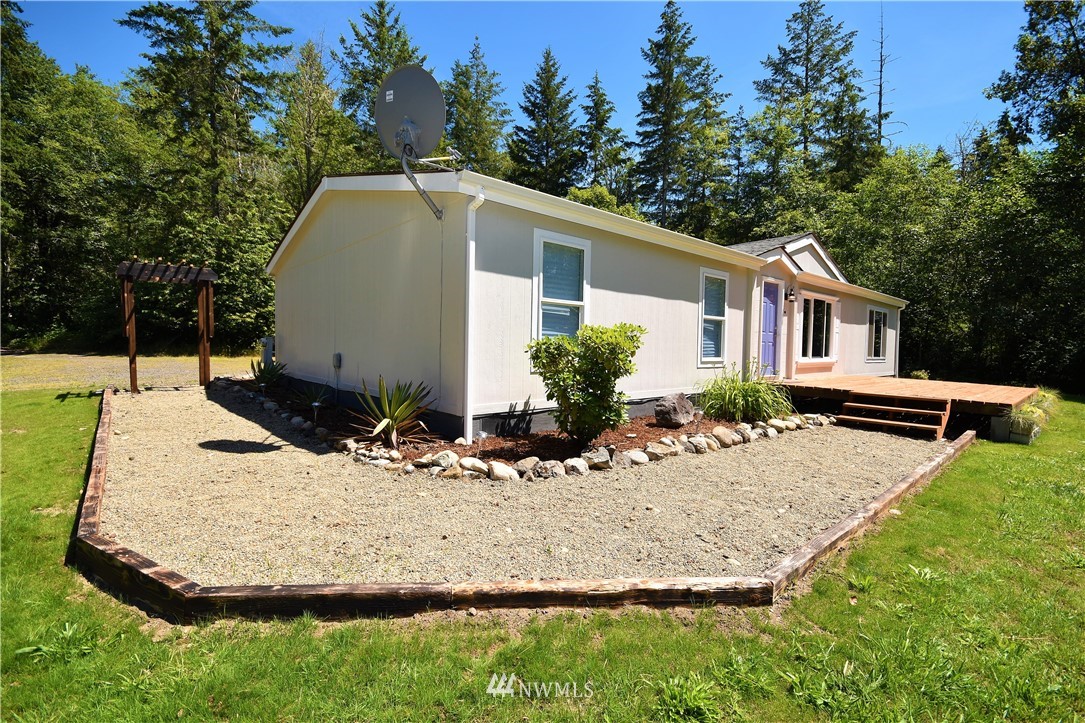 267 East Victor Road Belfair, WA 98528 - Photo 3 of 27 a view of a house with backyard