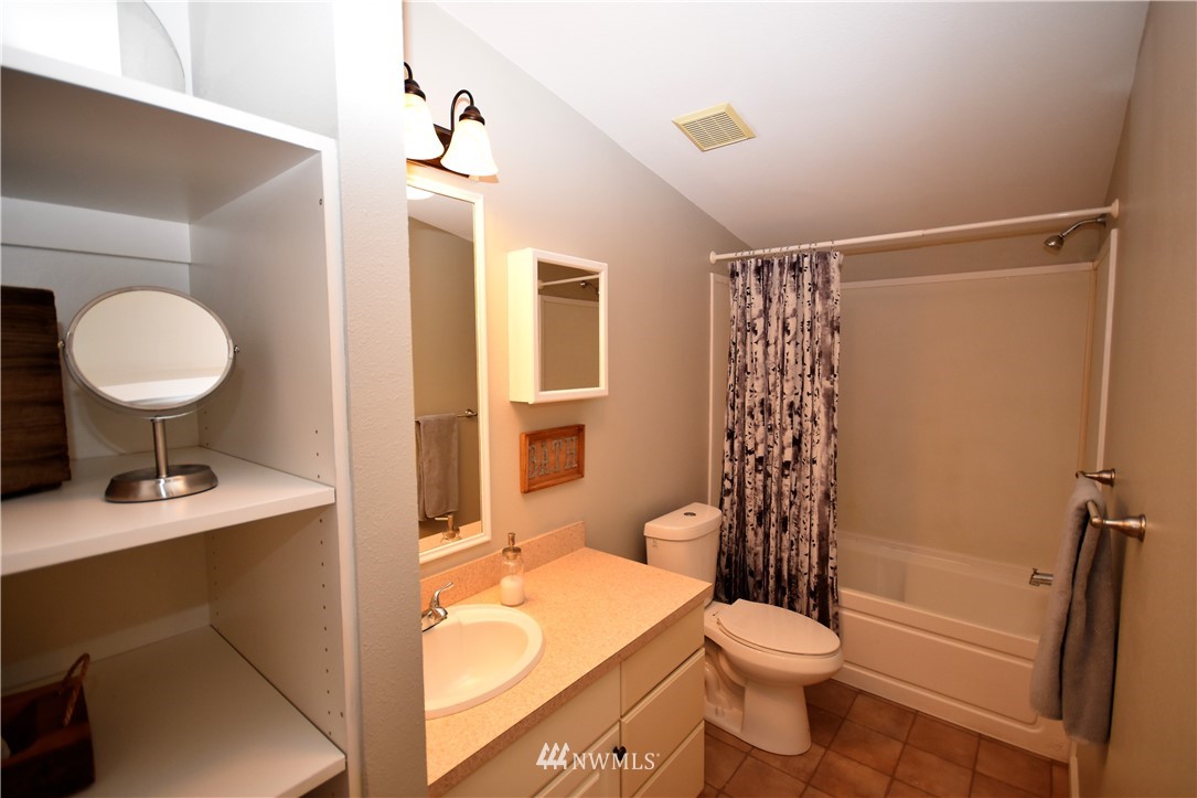 267 East Victor Road Belfair, WA 98528 - Photo 21 of 27 a bathroom with a sink toilet and shower