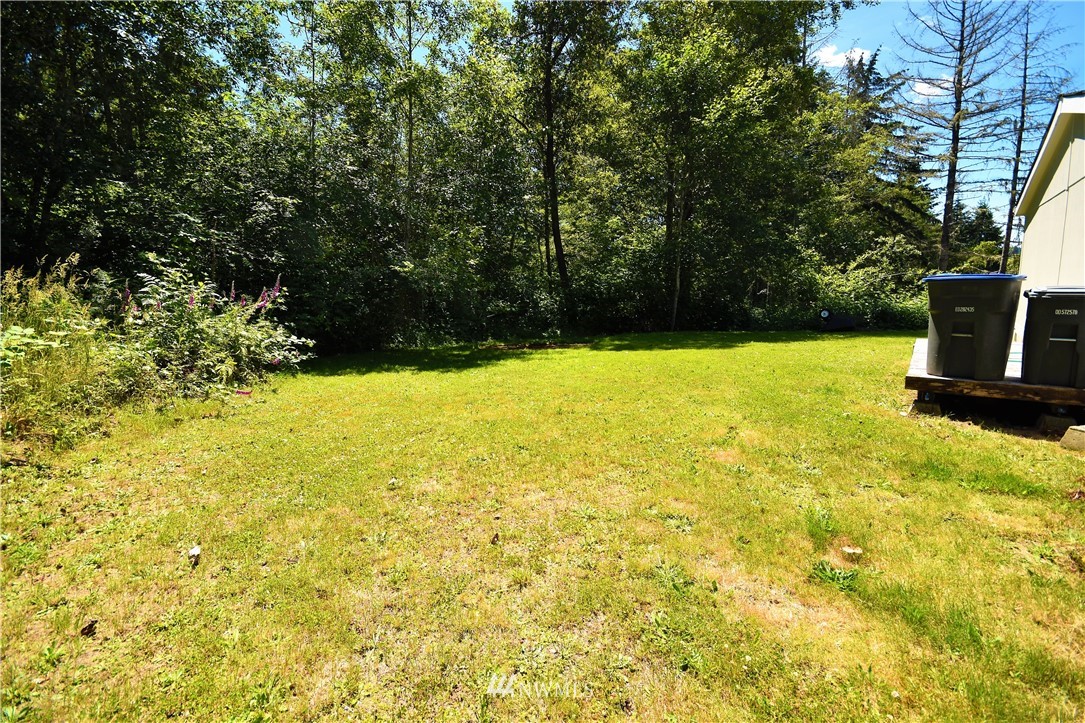 267 East Victor Road Belfair, WA 98528 - Photo 7 of 27 a view of an ocean with a yard