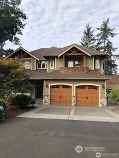 2223 Mayes Road Southeast Lacey, WA 98503 - Photo 1 of 1 a front view of a house with a garden