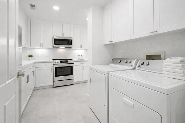 a utility room with dryer and washer