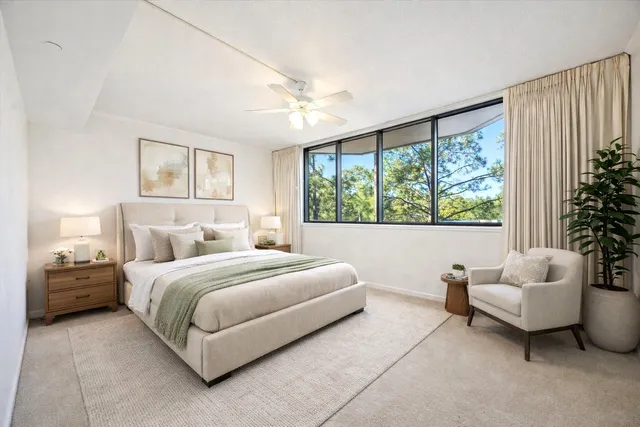 a bedroom with bed and a couch