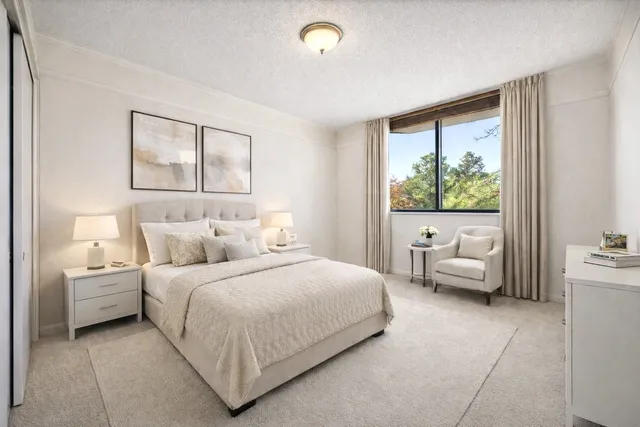 a bedroom with a bed and a couch