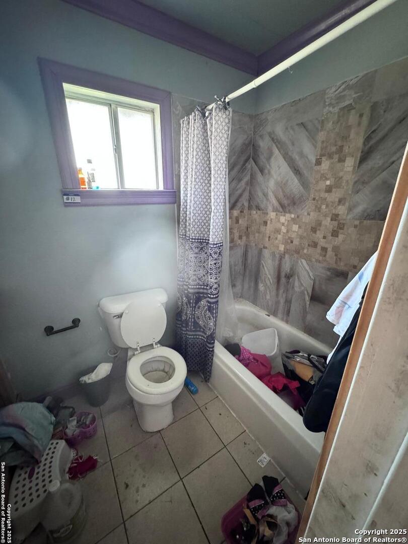 18186 Wisdom Road Lytle, TX 78052 - Photo 11 of 15 a bathroom with a toilet and a shower