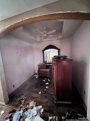 a room with water heater and wooden floor