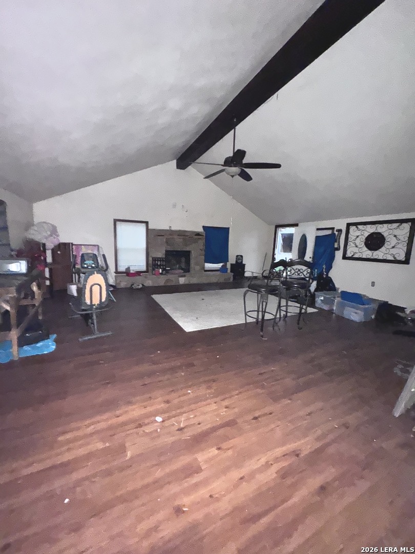 18186 Wisdom Road Lytle, TX 78052 - Photo 16 of 28 a living room with lots of furniture and gym equipment