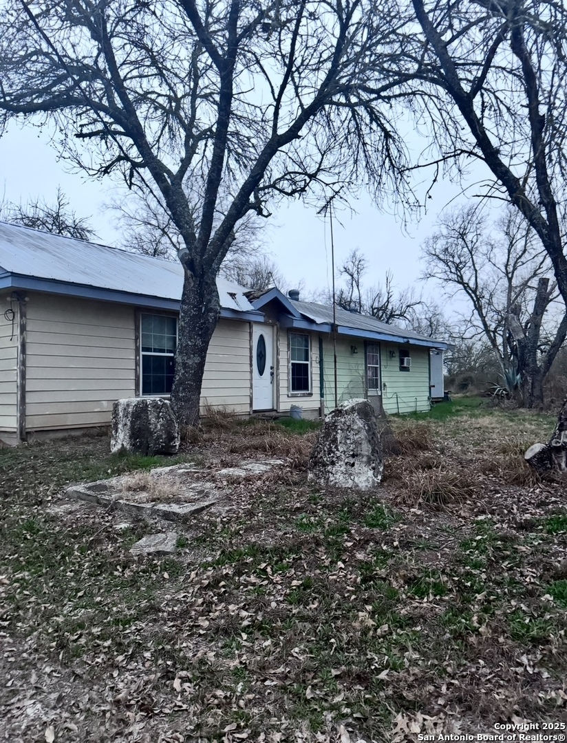 18186 Wisdom Road Lytle, TX 78052 - Photo 2 of 15 a view of a house with a yard and large tree