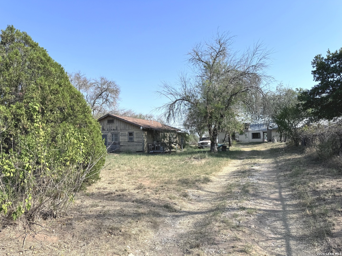 18186 Wisdom Road Lytle, TX 78052 - Photo 25 of 28 a view of a house with a yard