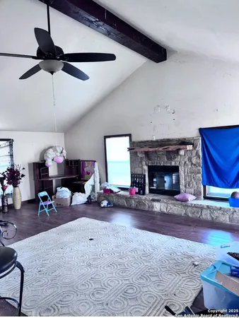 a view of a livingroom with furniture and a fireplace