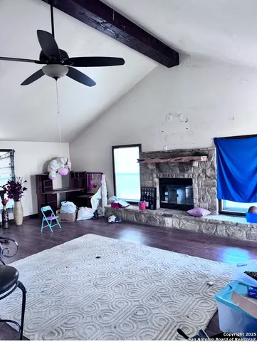 a view of a livingroom with furniture and a fireplace