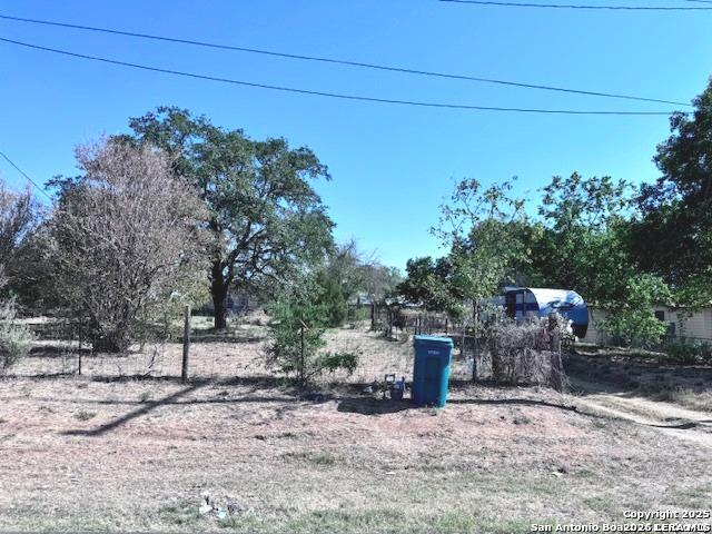 18186 Wisdom Road Lytle, TX 78052 - Photo 4 of 28 a backyard of a house with lots of green space