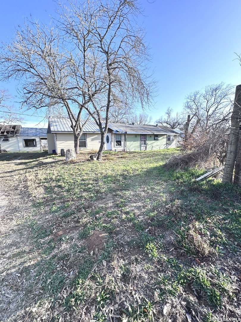 18186 Wisdom Road Lytle, TX 78052 - Photo 5 of 28 a backyard of a house with lots of green space