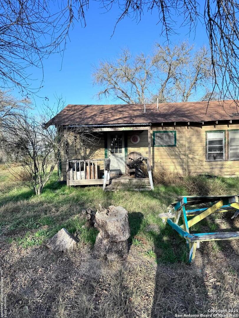 18186 Wisdom Road Lytle, TX 78052 - Photo 6 of 15 a front view of a house with garden