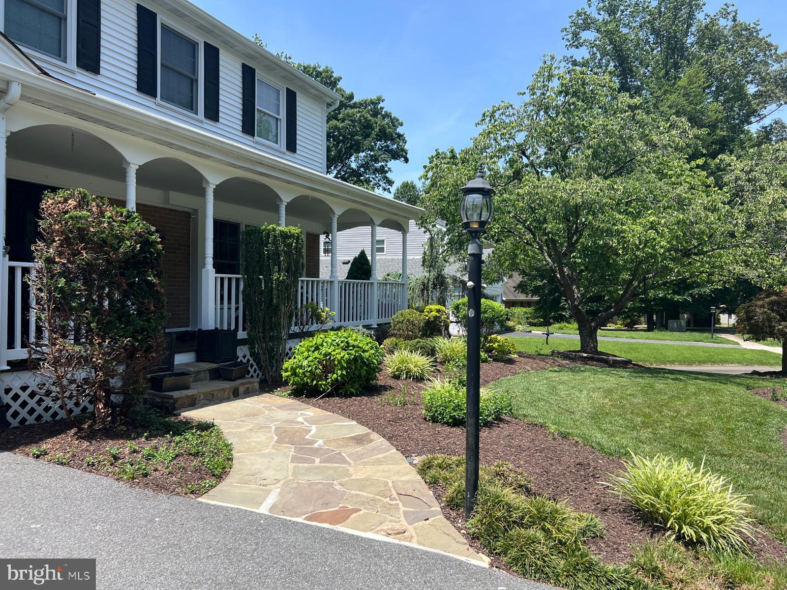 9201 Beachway Lane Springfield, VA 22153 - Photo 3 of 12 Charming porch with lush landscaping.