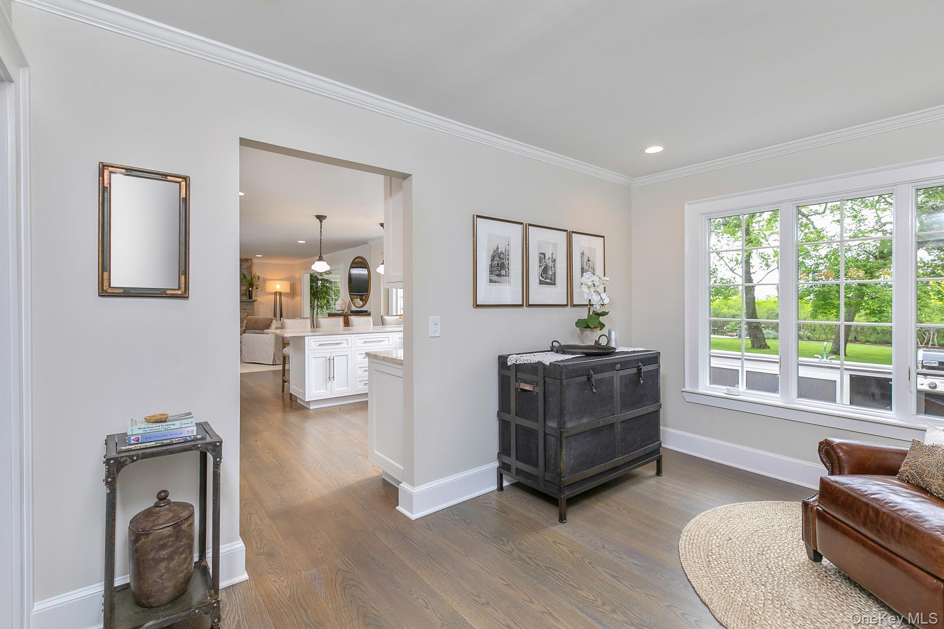 51 Halsey Road Remsenburg, NY 11960 - Photo 11 of 42 a living room with furniture and a large window