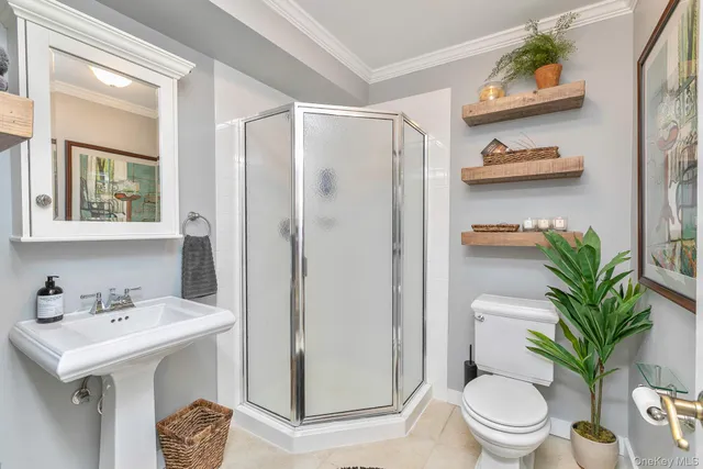 a bathroom with a sink a toilet and a shower curtain