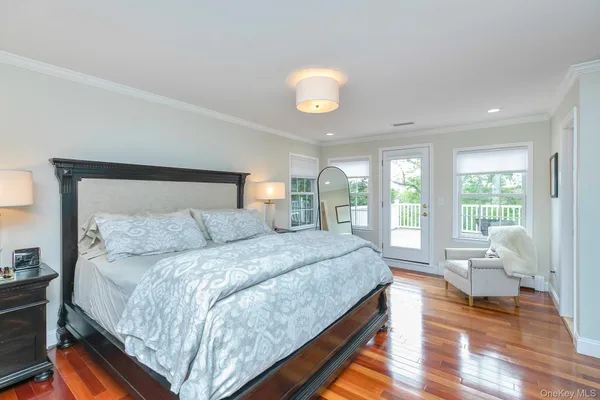 a spacious bedroom with a large bed and a large window