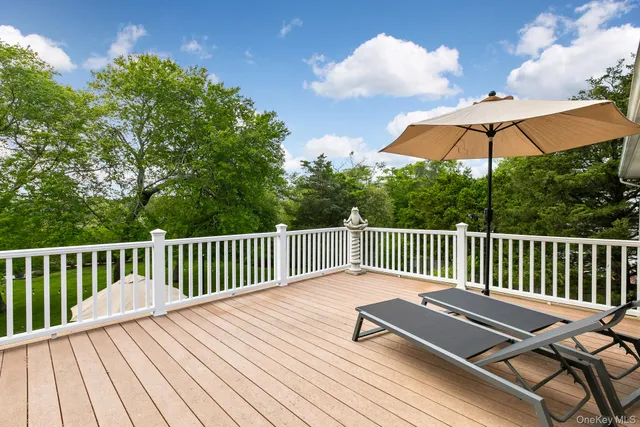 a view of balcony with wooden floor