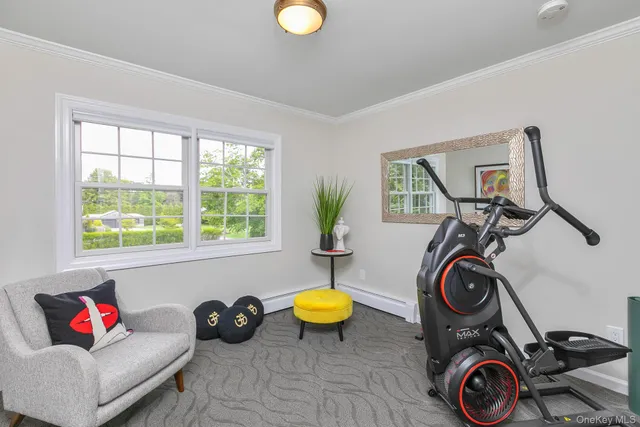 a view of a livingroom with furniture and a window